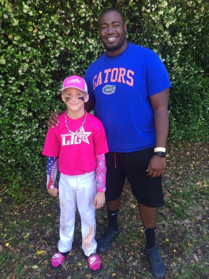 Sam with his nephew in his early travel-ball days