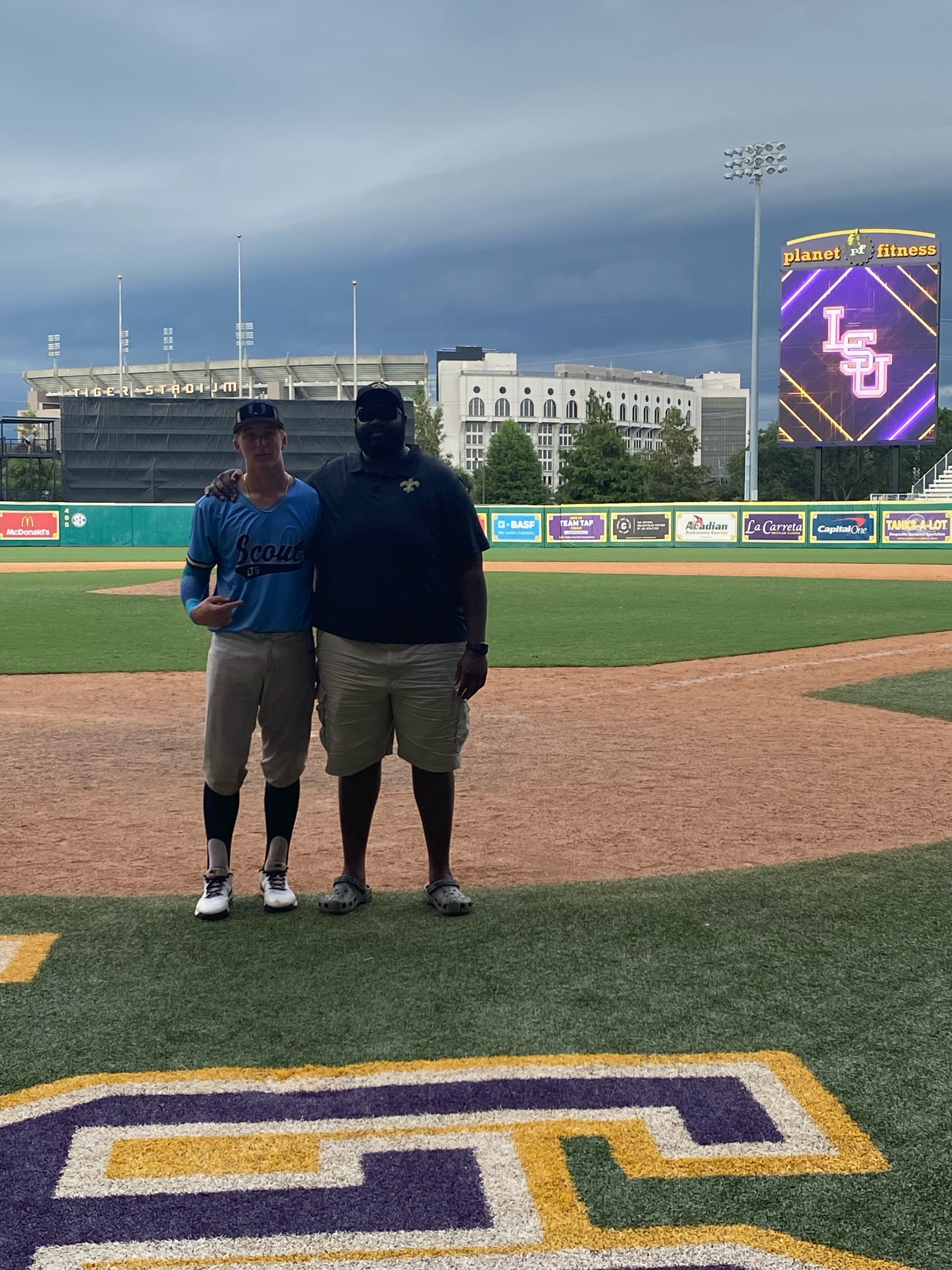 Sam with his nephew at an LSU showcase